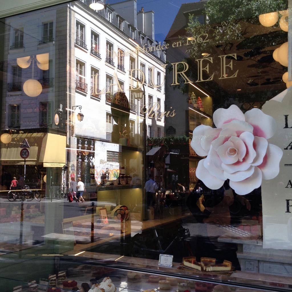 Reflections of Paris - Ladurée Pastry Shop in the Marais.  What a beautiful day!

@parisianperfectlifestyle
#paris  #ladurée  #frenchpastries